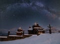 Night sky mith milkyway srars above countryside remote village church on hill top. Ukraine, Voronenko Royalty Free Stock Photo