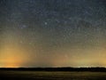 Night sky and milky way stars, Perseus, Cassiopeia over field Royalty Free Stock Photo