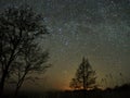 Night sky and milky way stars, Perseus, Cassiopeia over field Royalty Free Stock Photo