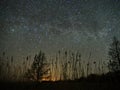 Night sky and milky way stars, Perseus, Cassiopeia over field Royalty Free Stock Photo