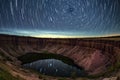 night sky over a meteor impact crater