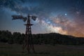 Night sky over old wethered windmill Royalty Free Stock Photo