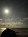 Night sky stars Pleiades and Moon set observing over sea coast Royalty Free Stock Photo