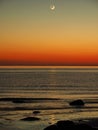 Night sky stars Pleiades Venus and Moon set observing over sea coast Royalty Free Stock Photo