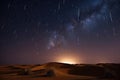 night sky with stars and meteor showers over the dunes of the sahara desert Royalty Free Stock Photo