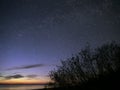 Night sky stars observing Perseus constellation over sea