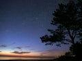 Night sky stars observing Perseus constellation over sea