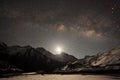 Night sky and stars passing by behind mountain Taboche, Cholatse, Machhermo village. Nepal