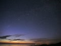 Night sky stars observing Perseus constellation over sea