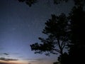 Night sky stars observing Perseus constellation over sea