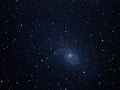 Night sky stars and spiral galaxy M33 over telescope Royalty Free Stock Photo