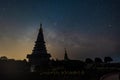 Night sky time lapse of moving Milky Way and stars under moon light at Phra Mahathat monuments on Doi Inthanon