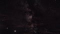 Night sky timelapse, many stars with satellites passing by, Milky way in region of Sagitta constellation visible, bright Saturn