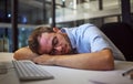 Night sleep, business burnout and businessman sleeping at his desk in his dark office at work. Tired corporate employee Royalty Free Stock Photo