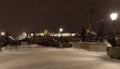 Night snowy colorful Prague Lesser Town with gothic Castle, St. Nicholas` Cathedral from Charles Bridge, Czech republic Royalty Free Stock Photo