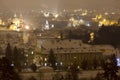 Night snowy foggy Prague City with St. Nicholas' Cathedral, Czech republic Royalty Free Stock Photo