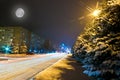 Night snowy road in the small town