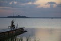 Night spin fishing. Casting a spinning rod to bait fish