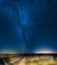 Night Starry Sky Above Country Road In Countryside And Green Field Royalty Free Stock Photo