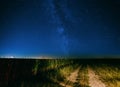 Night Starry Sky Above Country Road In Countryside And Green Field Royalty Free Stock Photo