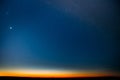 Night Starry Sky With Glowing Stars Above Countryside Field Landscape In Early Spring. Bright Glow Of Planet Venus In Royalty Free Stock Photo