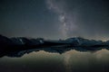 Night starry sky over mountains and lake.Texture or background Royalty Free Stock Photo
