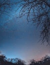 Night starry winter sky over the village. Astro landscape