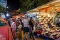 Night street market in Hanoi Old Quarter, people can seen exploring around it. Royalty Free Stock Photo