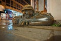 Bronze statue of Cumil, the happy sewage worker in the old town of Bratislava, night street view, Slovakia