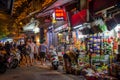 Night street view in Hanoi Old Quarter, people can seen exploring around it. Royalty Free Stock Photo