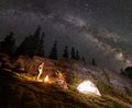 Night summer camping in the mountains under night starry sky Royalty Free Stock Photo