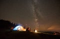 Night summer camping in the mountains under night starry sky Royalty Free Stock Photo