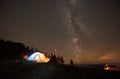 Night summer camping in the mountains under night starry sky Royalty Free Stock Photo