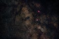 Night summer sky with milky way near Scutum constellation, bright Sagittarius clouds, purple Eagle and Swan nebula Royalty Free Stock Photo