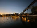 Night sunset scene in the shore of the Douro river with quiet sailing boats silhouettes in Porto skyline, Portugal Royalty Free Stock Photo