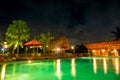 Night Swimming Pool with Bar in a Tropical Hotel Royalty Free Stock Photo