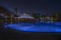 Night swimming pool in hotel at a local resort Royalty Free Stock Photo