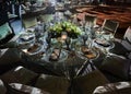 Night table set for dining and flowers decoration round table indoor luxury wedding with low light romantic ambient