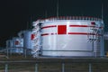 Night.Tanks with oil for further transportation of oil through pipes at an oil refinery and oil pumping station