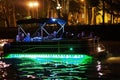 Night in Tbilisi at Mtkvari River, Speed Boat Passing. ourists on Board enjoy the beautiful views. Tbilisi, Georgia - june , 2019