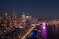 Night time aerial video view  of Seattle Downtown, with the Space Needle, Skyscraper and The Seattle Great Wheel at Waterfront Royalty Free Stock Photo