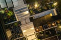 Night Time Aerial View of a Modern Backyard Garden with Architectural Concrete and a Fireplace