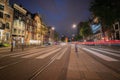 Night time in the city, lights, street markings and red light streams from passing traffic