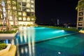 Night time of condominium and swiming pool