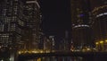 Night time exterior establishing shot of riverfront skyline in Chicago Royalty Free Stock Photo