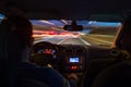 Night time highway from inside car with motion blurred speeding Royalty Free Stock Photo