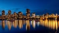 Bright colored reflections of city buildings illuminate waters of False Creek Vancouver Royalty Free Stock Photo