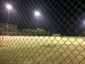 Night time soccer practice game at playing field outdoor