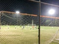 Night time soccer practice game at playing field outdoor Royalty Free Stock Photo