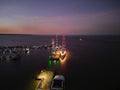 Night time sunset drone shot boat docked at Cairns Marina and Esplanade